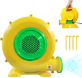 Yellow and green electric air blower for inflatables with a hand holding a second unit and ground stakes
