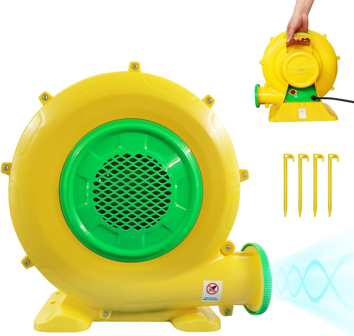 Yellow and green electric air blower for inflatables with a hand holding a second unit and ground stakes