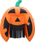 Giant orange jack-o'-lantern inflatable archway with a black streamer curtain in its mouth