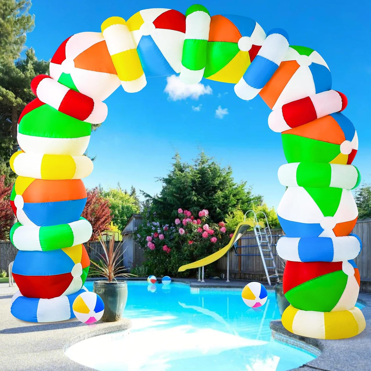Multicolor beach ball segment arch inflatable over a backyard pool