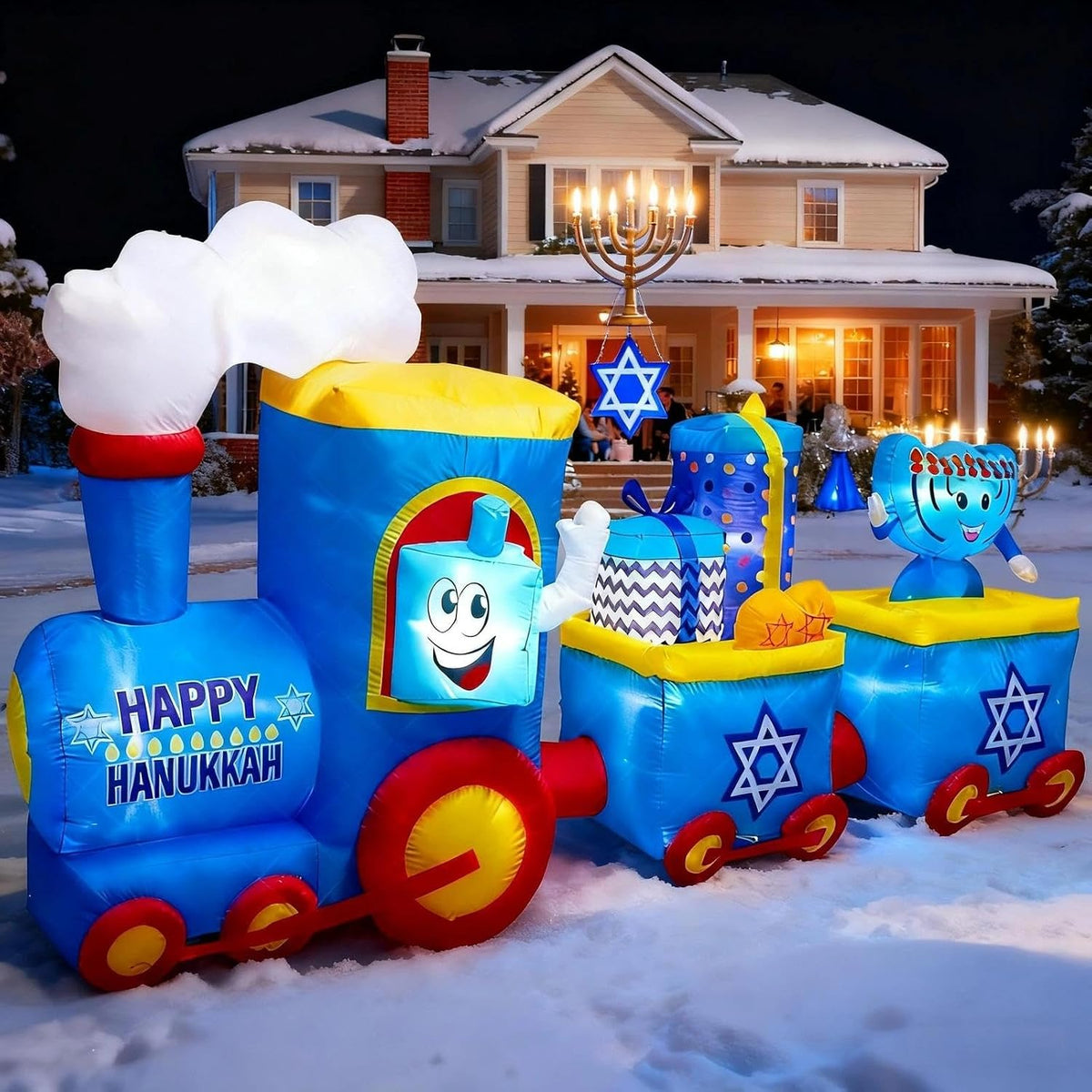 Blue Happy Hanukkah train inflatable with Star of David cars on a snowy lawn in front of a house