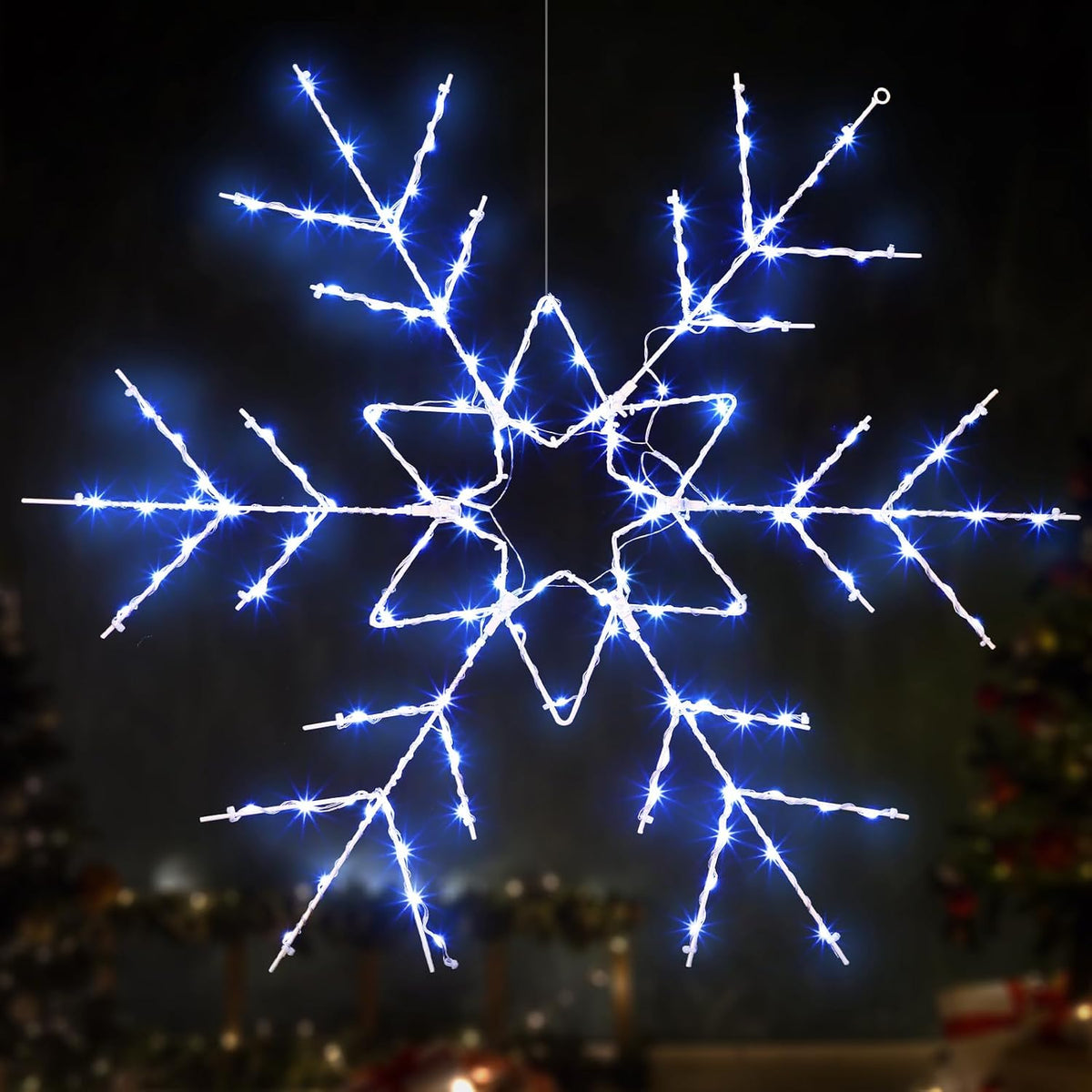 Large cool white LED snowflake outline glowing against a dark background