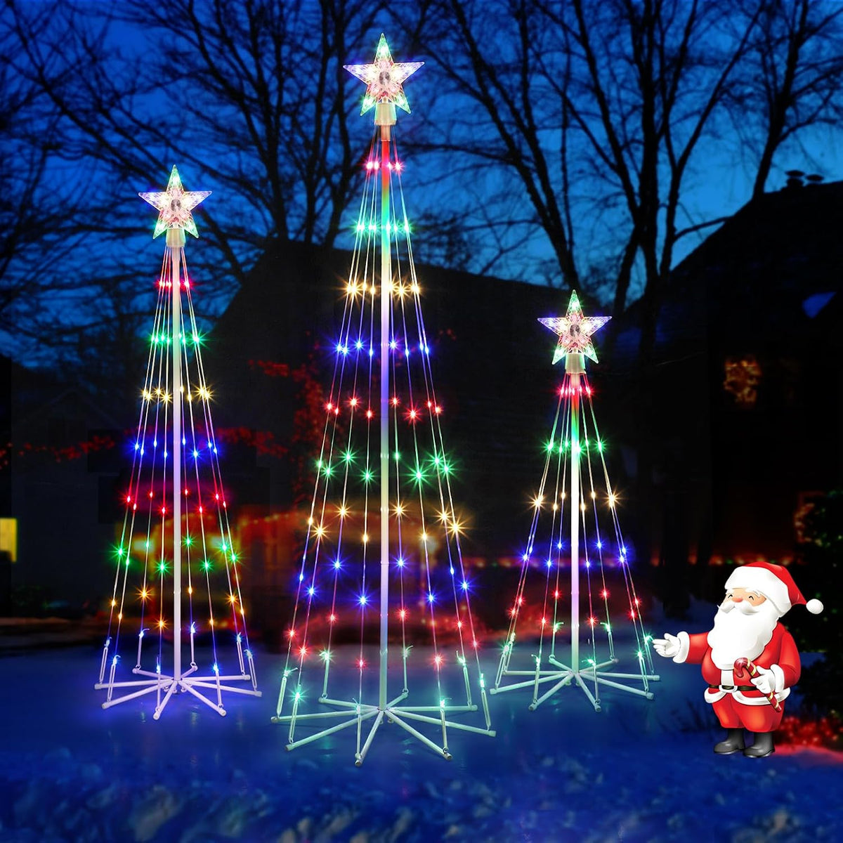 Three multicolor LED cone Christmas trees of different heights with star toppers on a lawn at night