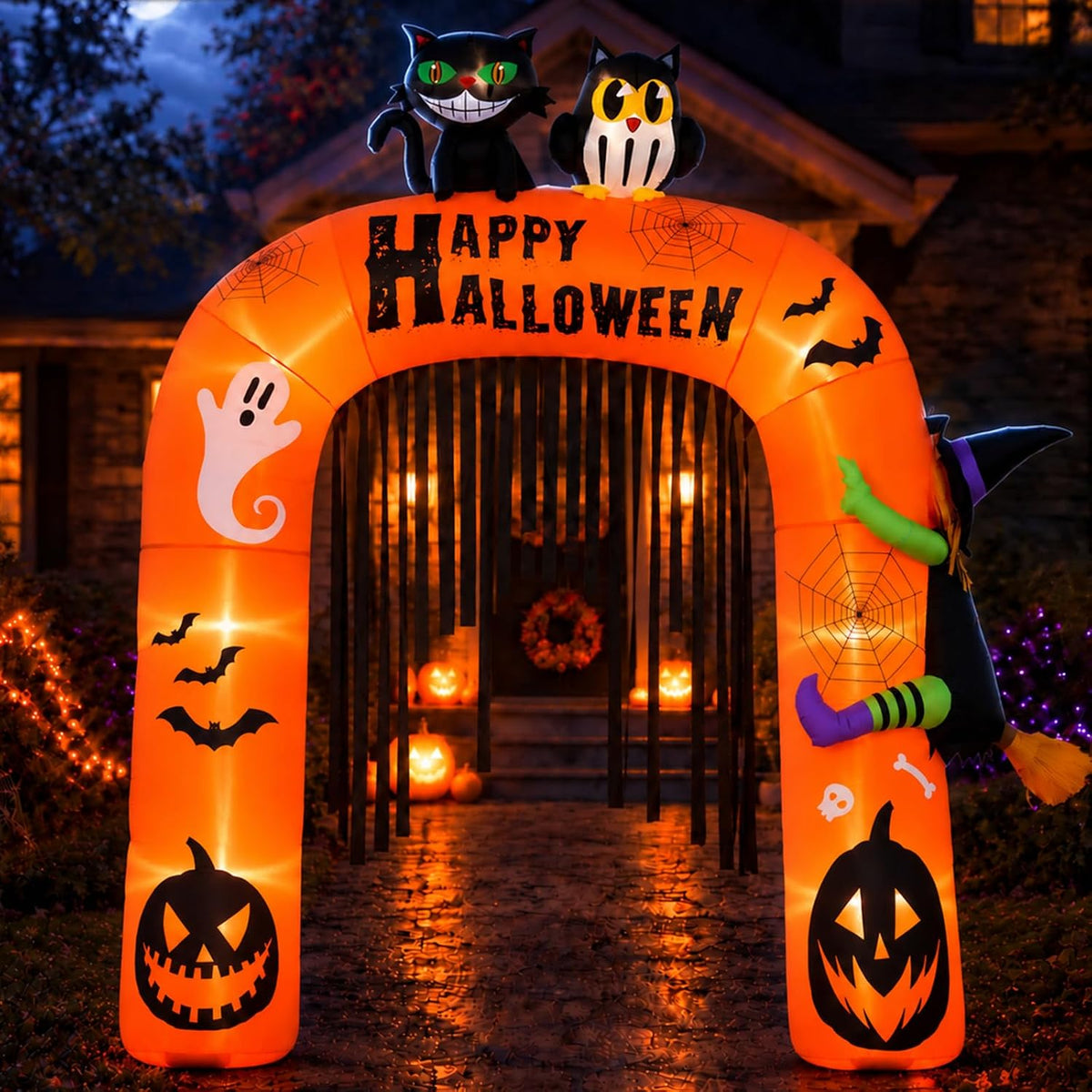 Orange Happy Halloween inflatable arch with a black cat and an owl on top glowing over a front path