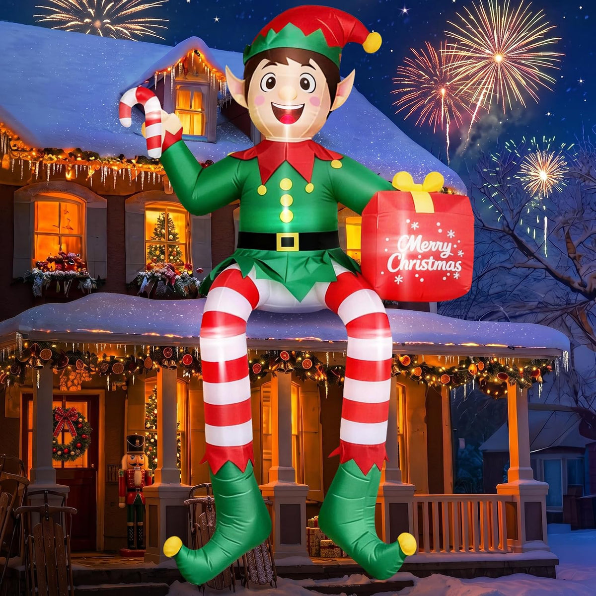 Giant elf inflatable with striped legs sitting on a porch roof holding a candy cane and a gift