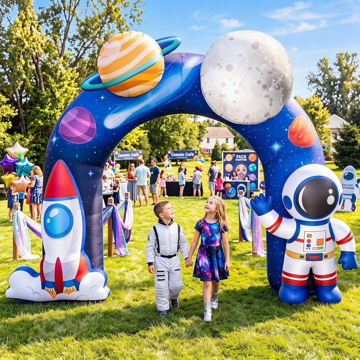 Galaxy print inflatable arch with a rocket, an astronaut and planets at an outdoor kids party