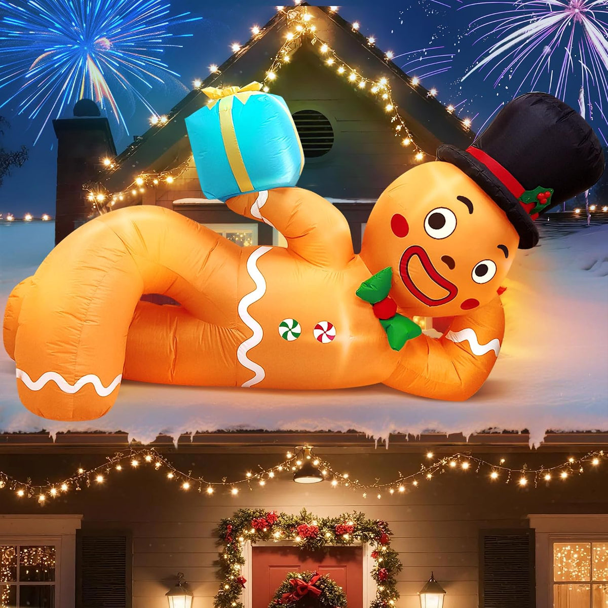 Lying gingerbread man inflatable in a top hat holding a blue gift with fireworks behind