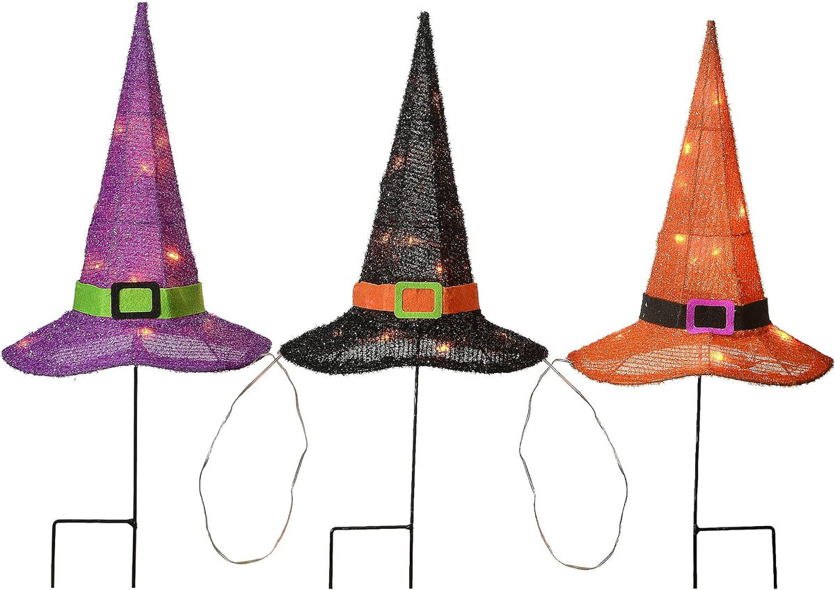 Three pre-lit witch hat garden stakes in purple, black and orange joined by a light wire