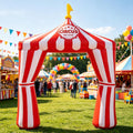 Red and white striped circus tent inflatable arch at an outdoor carnival party