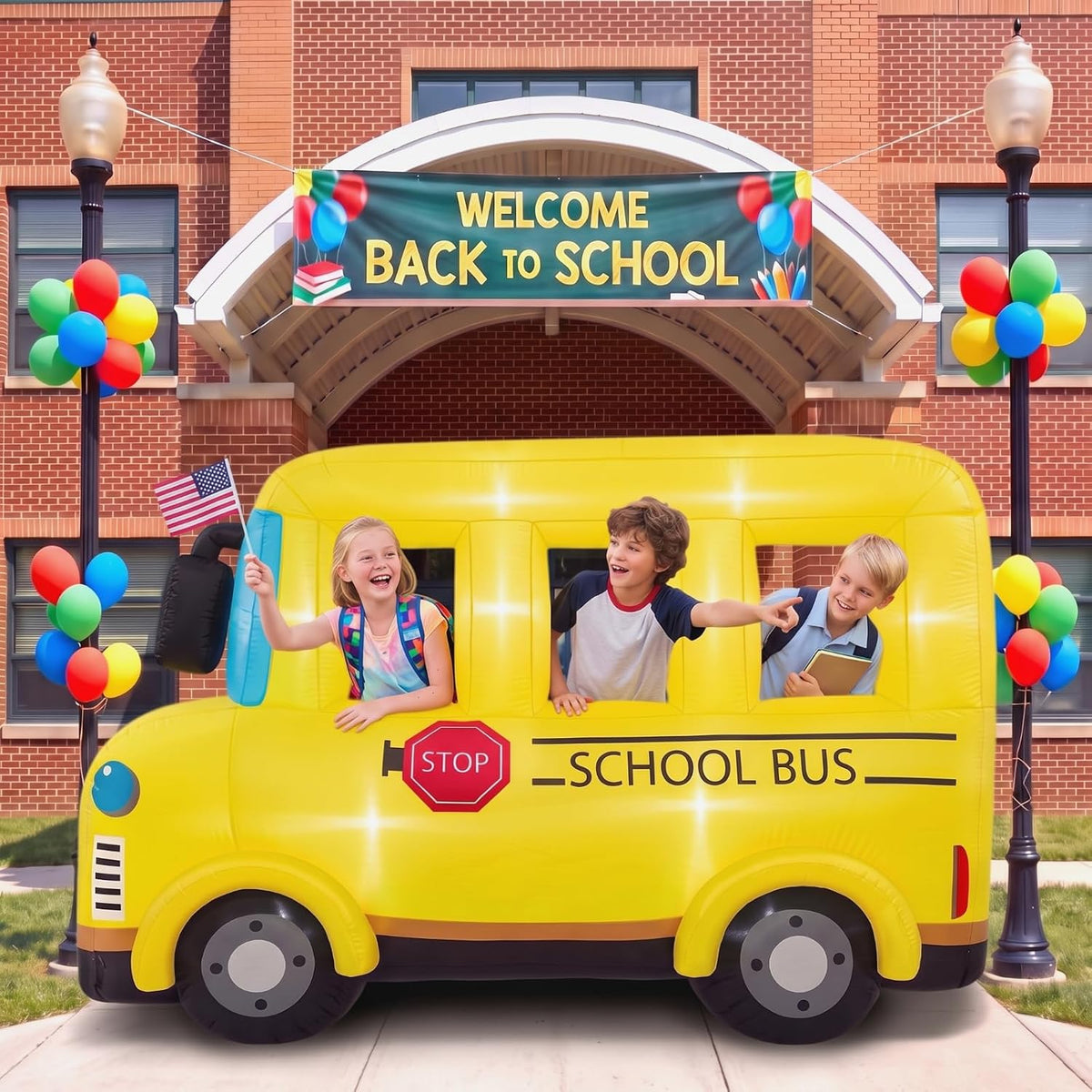 Yellow inflatable school bus with kids leaning out of the windows in front of a school with a Welcome Back to School sign